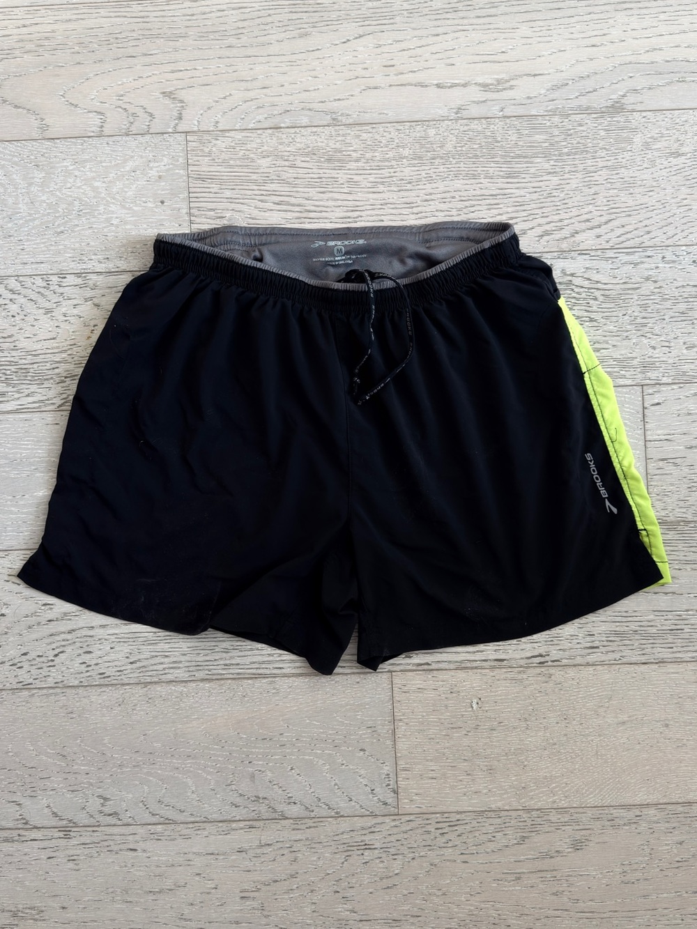 Brooks Men’s Black Running Shorts with Neon Yellow Side Panel